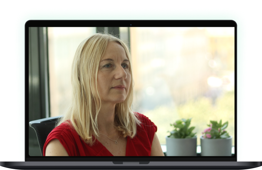 Mockup of Notebook playing video with CFO about Consistent Financial Reporting